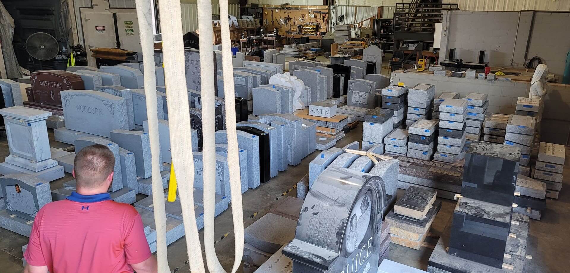 Aisle of upright granite and marble slabs in storage at the plant